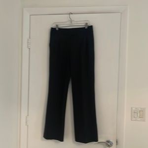 Black French connection pleaded trousers. Never worn. Wool and spandex.